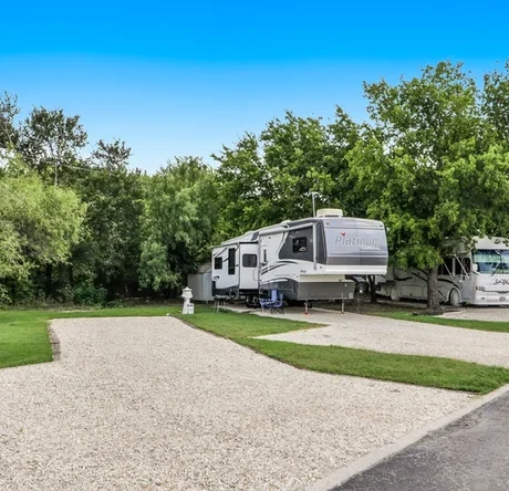 RV parked next to trees